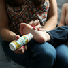 Roll Organic Magnesium Oil with Aloe onto the soles of feet.